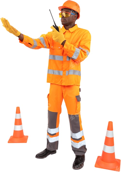 Preview: a man dressed as a construction worker standing between traffic cones