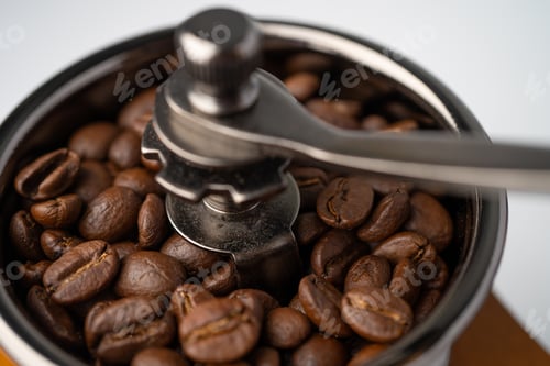 Preview: Coffee bean roasted in wooden grinder.