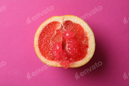 Preview: Half of grapefruit with caviar on pink background