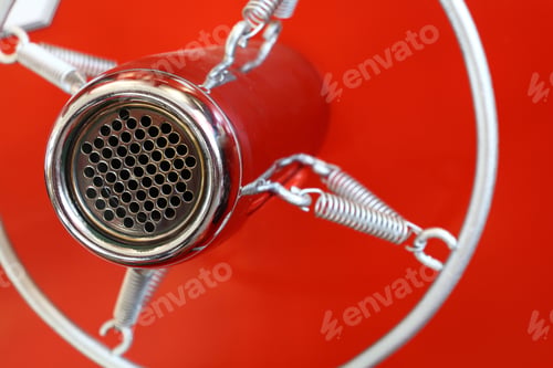 Preview: Vintage old round studio voice microphone over red