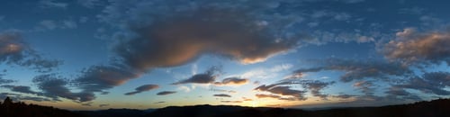 Preview: Stunning sunset fills sky with rich hues of blue and orange.