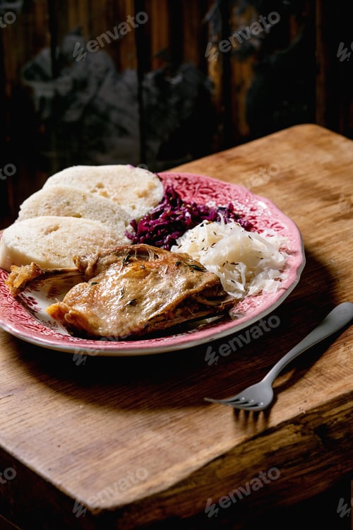 Preview: Baked duck legs with sliced boiled knedliks and sauerkraut