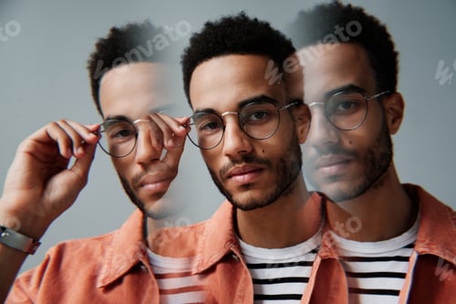 Preview: African American man adjusting eyewear