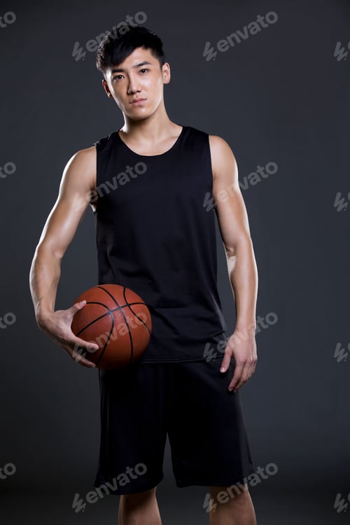 Preview: Young man holding a basketball
