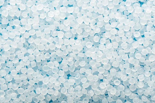 Preview: White plastic resin pellets fill blue frame, macro pattern for medical manufacturing