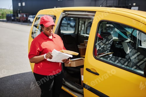 Preview: Delivery Worker Checking Packages Near Yellow Van