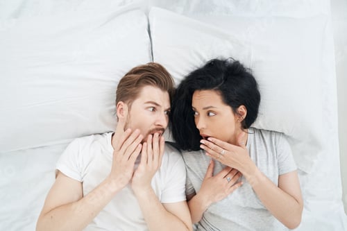 Preview: Man and woman experiencing panic attack in bedroom