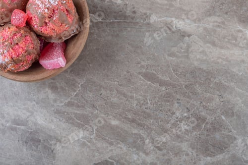 Preview: Snack cakes and marmelades in a small bowl on marble background