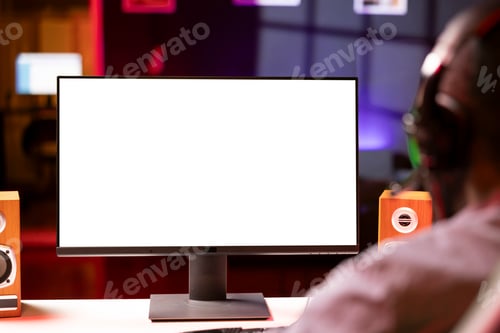 Preview: Mockup display used by man playing on PC, using headphones to talk, close up