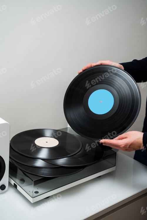 Preview: Music fan holding vintage vinyl rock record with rich hi fi sound