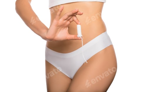 Preview: woman dressed in white panties, holding a clean tampon in her hands, close-up. female hygiene