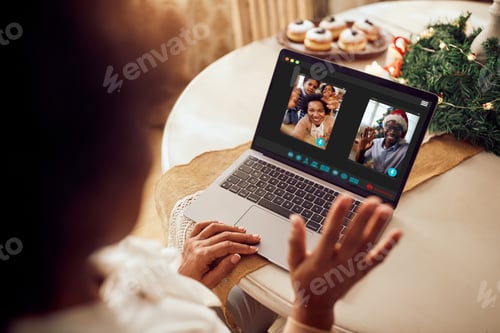 Preview: Close-up of African American family greeting during video call on Christmas.