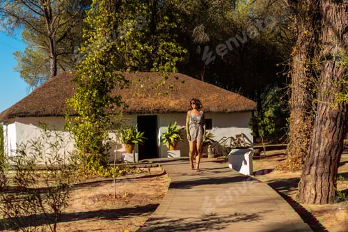 Preview: A tourist visiting an old hut in the Doñana Natural Park, Huelva. Andalusia