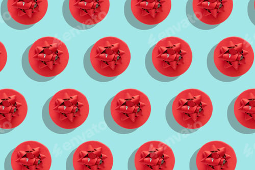 Preview: Pattern red gift box with decorative bow on blue surface top view flat lay. Holiday concept new year