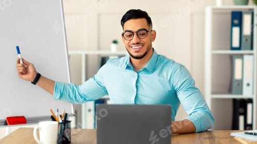 Preview: English teacher giving remote lesson on laptop pc, communicating with students on webcam at home