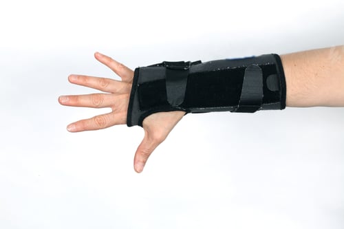 Preview: Closeup shot of a hand in an orthopedic medical fitness wrist bandage