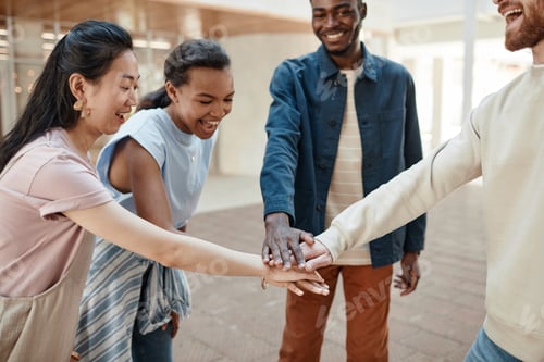 Preview: Group of Friends Stacking Hands Outdoors