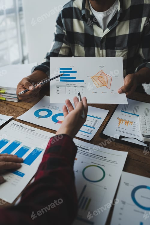 Preview: Business people meeting explaining the financial graph data and marketing plan. Group of business pe