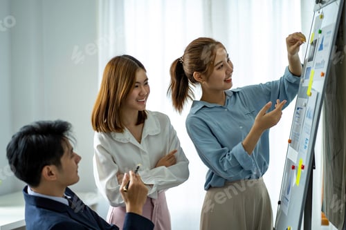 Preview: group of professional Asian businessmen use paper on the board. Writing a business plan strategy for