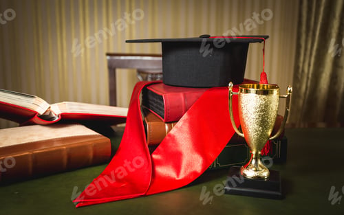 Preview: graduation hat, red ribbon and golden cup for first place