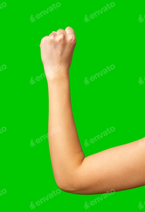 Preview: Fist raised in determination against a bright green background showing strength and motivation