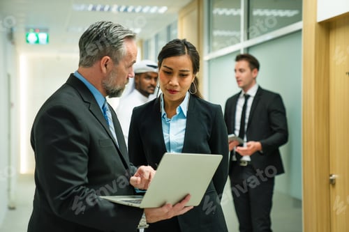 Preview: Successful business team working together in a co-working office.