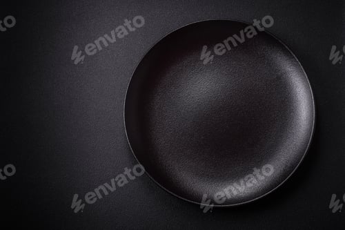 Preview: Bumpy empty ceramic plate on a textured concrete background
