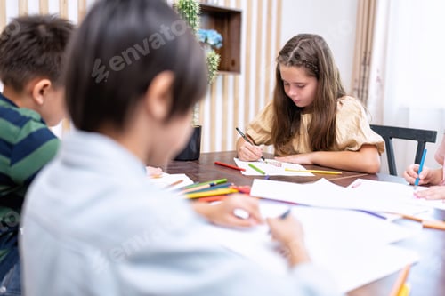 Preview: Children in class room happy laughing enjoy draw picture on paper and show to friend