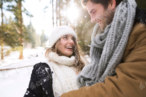 Preview: Happy young couple face to face in winter