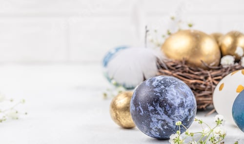Preview: Colorful Easter eggs with spring blossom flowers on light background