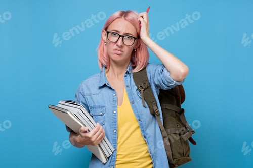 Preview: puzzled student with books scratching her head trying to make a decision.