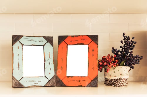 Preview: Still life of empty retro and vintage photo frame with flower pot.