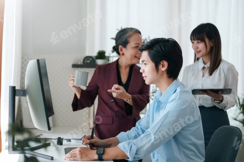 Preview: Asian boss or senior employee provide professional help and guidance to intern