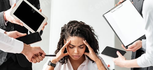 Preview: Stressed Businesswoman At Laptop Touching Head Sitting In Modern Office