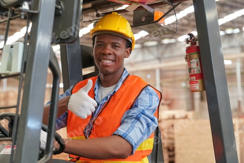 Preview: Young black man working at lumber distribution warehouse.