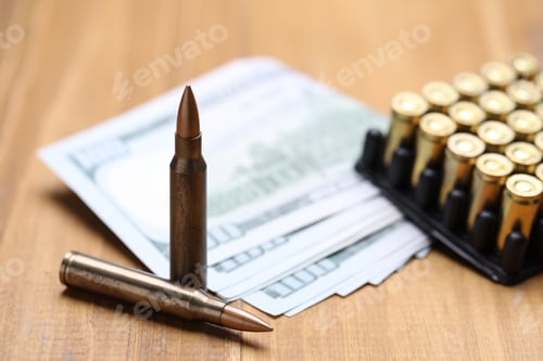 Preview: Firearm cartridges and dollars on wooden table, closeup