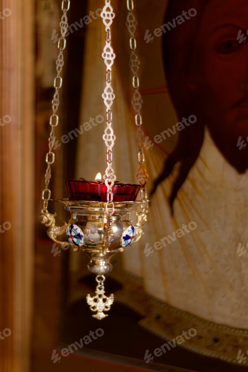Preview: Icon lamp in front of icon in Orthodox Church. Indoors, day light Front view.
