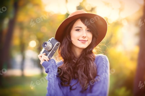 Preview: portrait of young woman with camera