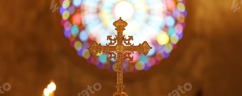 Preview: The cross standing on christian church and flare background.