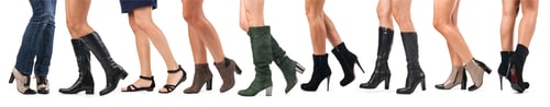 Preview: Cropped view of young women wearing different shoes, and boots
