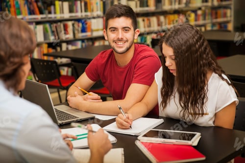 Preview: Young man studying with friends