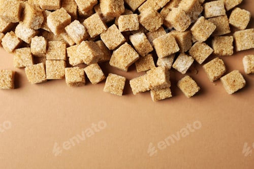 Preview: Many sugar cubes on craft background, space for text