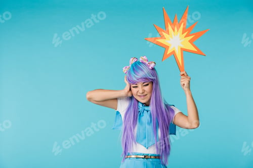 Preview: Irritated asian anime girl in wig posing on blue