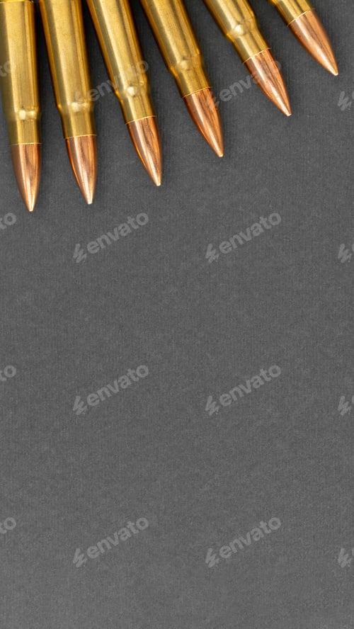 Preview: Bullets on gray background. Cartridges 7.62 caliber for Kalashnikov assault rifle