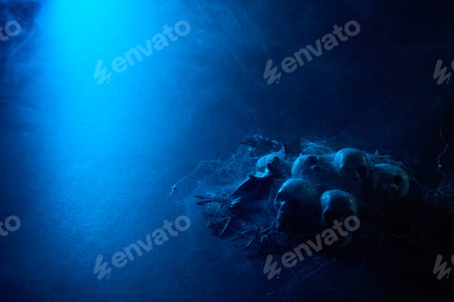 Preview: Halloween human skulls in abstract smoke on black background.