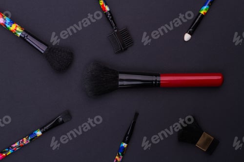 Preview: Various makeup brushes on black.