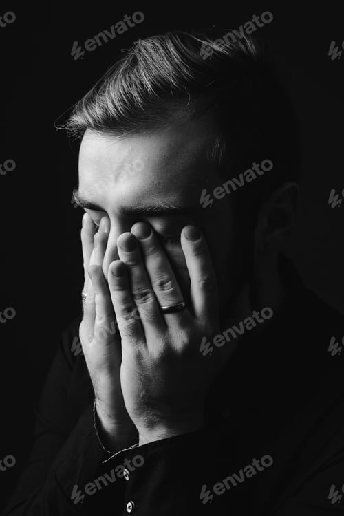 Preview: Black and white portrait of a stylish man with a beard and stylish hairdo dressed in the black shirt