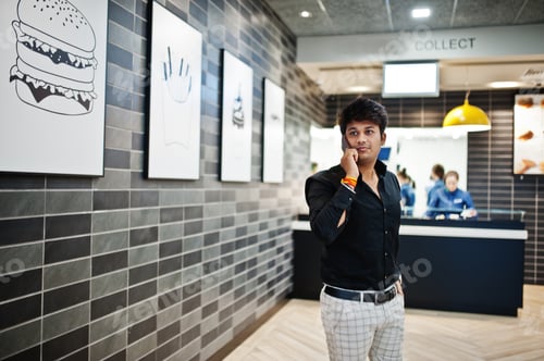 Preview: Indian man at fast food cafe