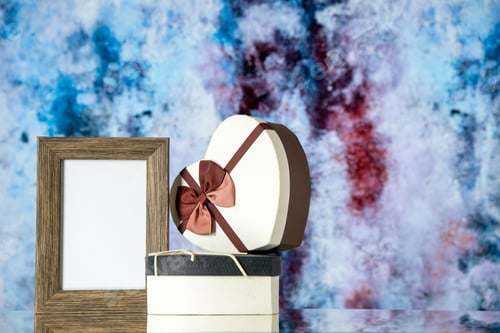 Preview: front view valentines day presents with empty picture frame on light background feeling love couple