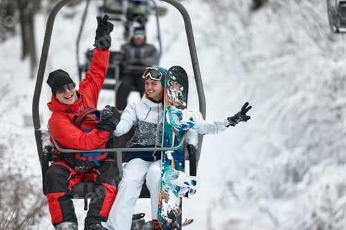 Preview: People using chairlift at mountain ski resort. Winter vacation